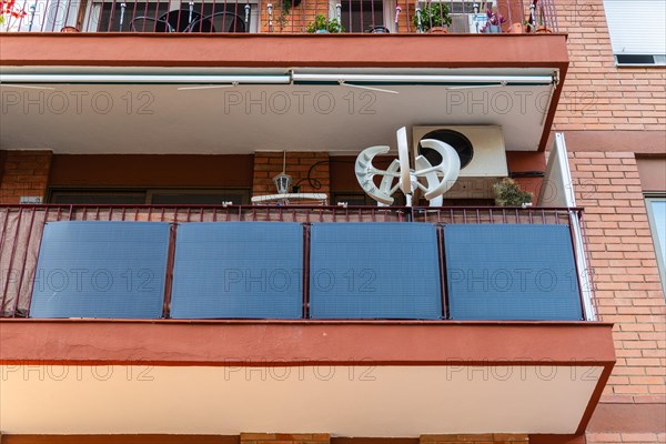 Balcony power plant and mini wind turbine on a balcony of a high-rise building in Barcelona, Spain, Europe