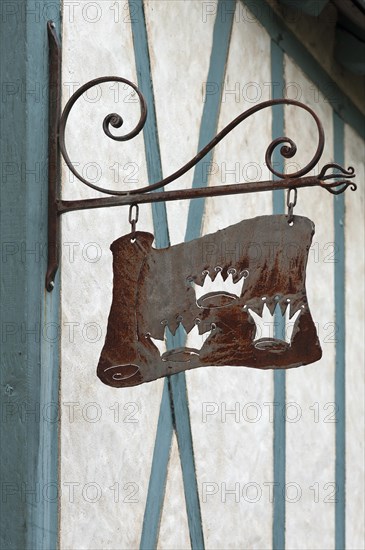 Old nose sign of a former Three Crowns inn, on a half-timbered house, Langeais, France, Europe