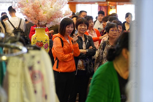 Chongqing, Chongqing Province, China, Cheerful crowd gathers on board a ship, some smiling at the camera, Chongqing, Chongqing, Chongqing Province, China, Asia