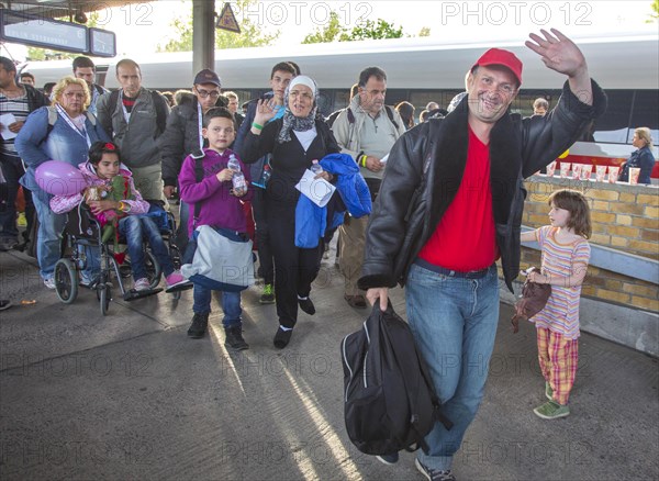 Syrian refugees have arrived at Schoenefeld station on a special train. They are then taken by bus to accommodation in Berlin, 13/09/2015, Schoenefeld, Brandenburg, Germany, Europe