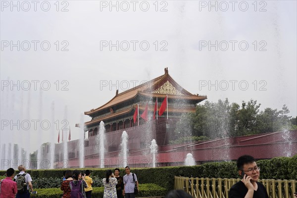 China, Beijing, Forbidden City, UNESCO World Heritage Site, tourists visit a cultural landmark with fountains on a cloudy day, Asia