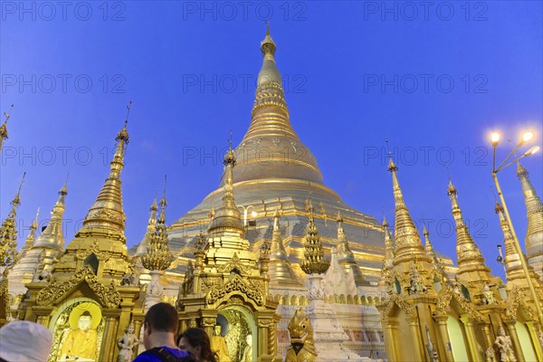 Shwedagon Pagoda, Yangon, Myanmar, Asia, The Shwedagon Pagoda at night, illuminated by floodlights and visited by worshippers, Asia