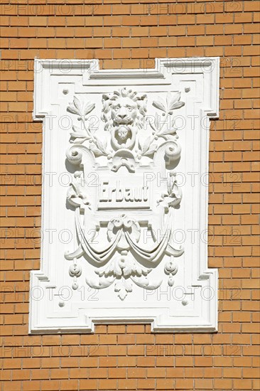 White, decorated plaque on a brick wall of an old Bremen house from the Wilhelminian era, Bremen, Germany, Europe