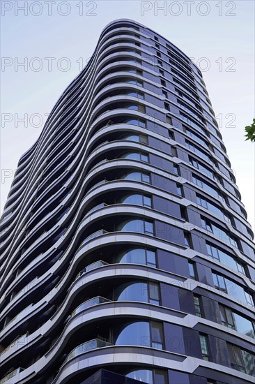 Shanghai, China, Asia, Modern skyscraper with undulating facade against a clear sky, People's Republic of China, Asia