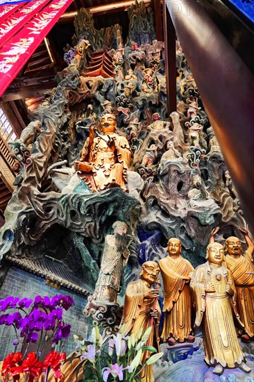 Jade Buddha Temple, Shanghai, Complex multi-layered wooden sculpture with Buddha statues and dragons in a temple, Shanghai, China, Asia
