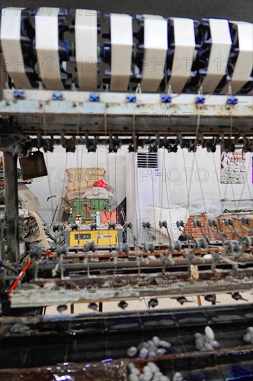 Silk factory Shanghai, close-up of a weaving machine with stripe pattern in a textile factory, Shanghai, China, Asia