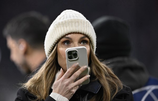 TV presenter Laura Wontorra DAZN, portrait, cap, speaks into smartphone, mobile phone, Allianz Arena, Munich, Bavaria, Germany, Europe