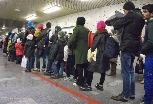 Refugees have arrived at Schoenefeld station on an IC train. They are then taken by bus to accommodation in Berlin, 02.12.2015, Schoenefeld, Brandenburg, Germany, Europe