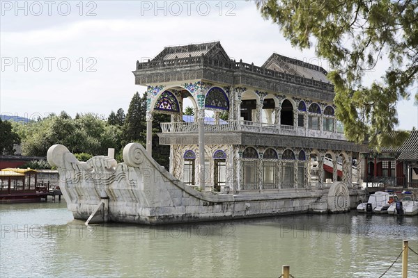 New Summer Palace, Beijing, China, Asia, Marble boat 'Shi Fang', Beijing, Famous marble boat on a lake with traditional Chinese architecture and cloudy sky, Asia