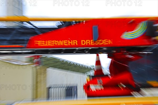 Motion blur shows the fast action of a fire brigade turntable ladder