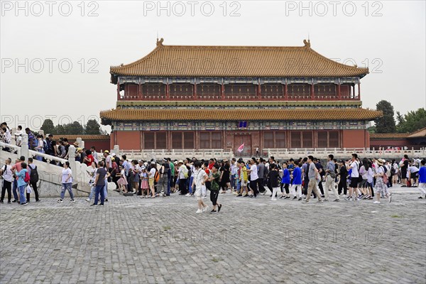China, Beijing, Forbidden City, UNESCO World Heritage Site, crowd gathered in an area of the Forbidden City, surrounded by historic buildings, Asia
