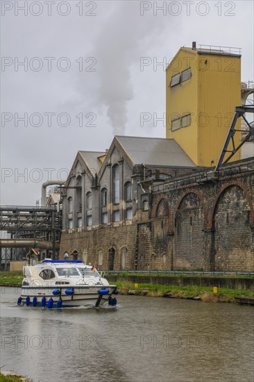 Solvay chemical plant for the production of bicarbonate and carbonate of soda or sodium carbonate, motorboat on the Meurthe, Dombasle-sur-Meurthe, department of Meurthe-et-Moselle, Lorraine, Grand Est region, France, Europe