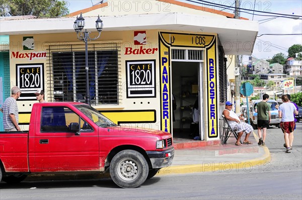 San Juan del Sur, Nicaragua, Bakery and cafe on a busy street corner with people walking by, Central America, Central America