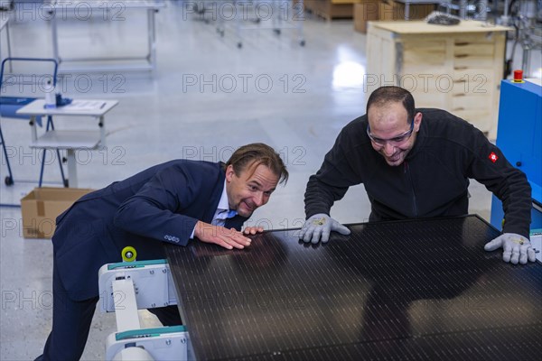 Sunmaxx PVT is a new innovative developer of photovoltaic thermal solar modules. The Fraunhofer ISE has confirmed an overall efficiency of 80% for the PX-1 premium module. The innovation is the combination of photovoltaics and solar thermal energy in one element. Dr Jiri Springer Chief Technology Officer (CTO) and employee Emad Sidhorn at a PVT module, Ottendorf-Okrilla, Saxony, Germany, Europe