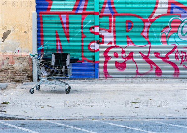 A shopping trolley full of metal and electronic scrap belonging to a scrap collector who sells it for a living, Barcelona, Spain, Europe