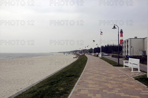 Sylt, North Frisian Island, Schleswig Holstein, Promenade along a sandy beach with flags and empty benches, Sylt, North Frisian Island, Schleswig Holstein, Germany, Europe