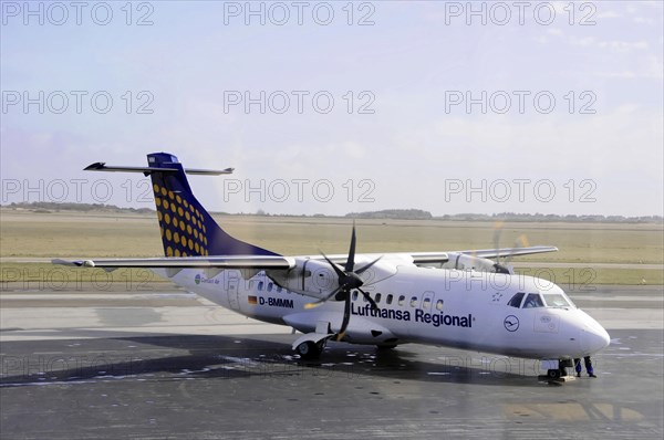 Sylt Airport, Sylt, North Frisian Island, Schleswig-Holstein, Lufthansa Regional propeller aircraft standing on a runway, Sylt, North Frisian Island, Schleswig-Holstein, Germany, Europe