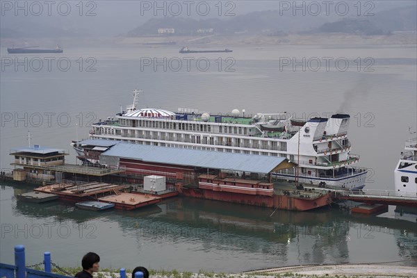 Cruise ship on the Yangtze River, Yichang, Hubei Province, China, Asia, A river cruise ship moored at a pier in the haze, Shanghai, Asia