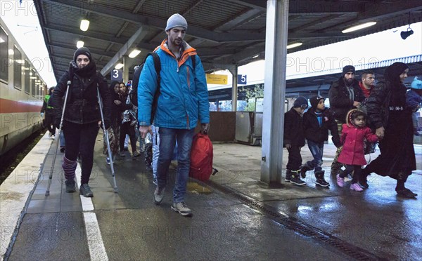 Refugees have arrived at Schoenefeld station on an IC train. They are then taken by bus to accommodation in Berlin, 02.12.2015, Schoenefeld, Brandenburg, Germany, Europe