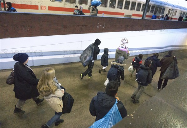 Refugees have arrived at Schoenefeld station on an IC train. They are then taken by bus to accommodation in Berlin, 02.12.2015, Schoenefeld, Brandenburg, Germany, Europe