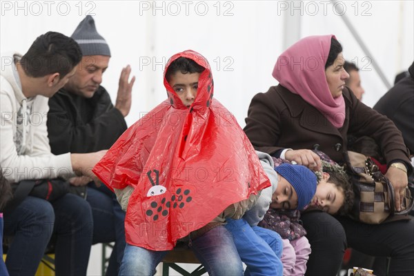 A Syrian refugee family and their children wait in a tent at the Berlin State Office for Health and Social Affairs for their registration, 15 October 2015, Berlin, Berlin, Germany, Europe