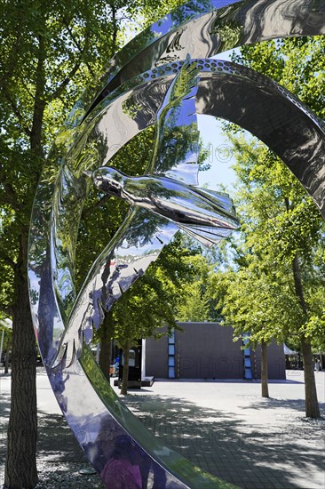 Beijing, China, Asia, Abstract shiny metal sculpture reflects the surroundings in a park, Asia