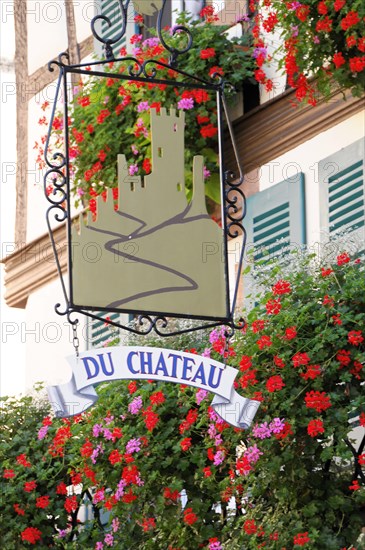 Kaysersberg, Alsace Wine Route, Alsace, Departement Haut-Rhin, France, Europe, sign with the inscription 'Du Chateau', surrounded by flowers and vines, Europe