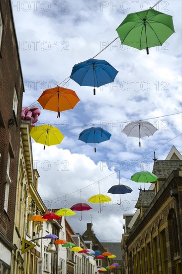 Colourful colourful umbrellas in the city centre, centre, jewellery, decorated, decoration, festive, umbrella, colourful, joyful, atmosphere, urban, design, hanging, hanging, travel, city trip, tourism, shopping, shopping, home, architecture, Dutch, creative, Deventer, Netherlands