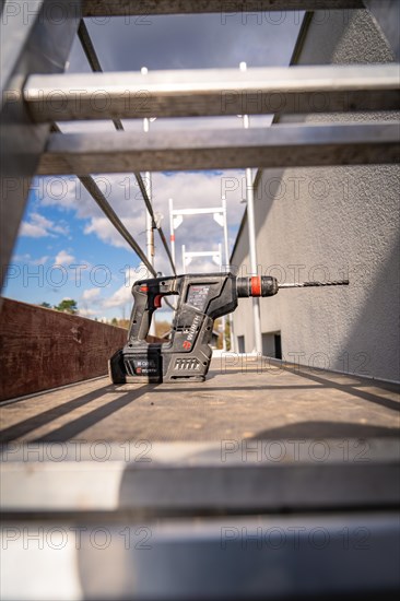 A cordless screwdriver lying on a wooden floor on a construction site, Solar systems construction, Craft, Muehlacker, Enzkreis, Germany, Europe