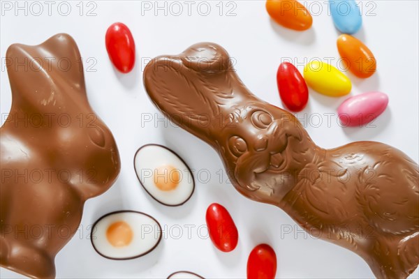 Easter, symbol photo, Easter bunny made of chocolate and colourful Easter eggs, text free space, Germany, Europe