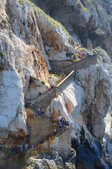 Stairs with visitors on the outside of the Capo Caccia cliff near Grotta Nereo cave, Alghero, Sassari Province, Sardinia, Italy, Mediterranean Sea, South Europe, Europe