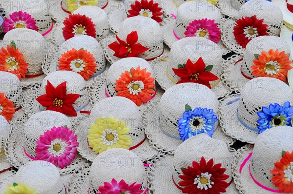 Leon, Nicaragua, Colourful decorated hats with flowers on a traditional market stall, Central America, Central America