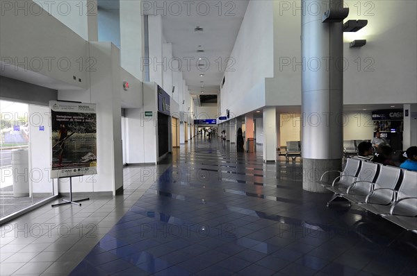 AUGUSTO C. SANDINO Airport, Managua, Empty waiting area in the airport with rows of seats and large windows, Nicaragua, Central America, Central America