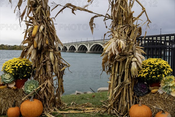 Detroit, Michigan, Halloween decorations along the Detroit Riverwalk. The bridge to Belle Isle is in the background