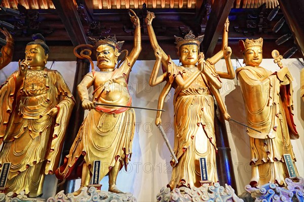 Jade Buddha Temple, Shanghai, Several large gold-coloured statues in an Asian temple, Shanghai, China, Asia