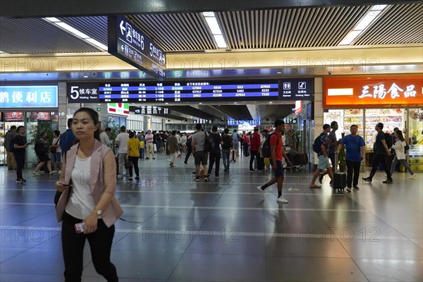 Hongqiao Railway Station, Shanghai, China, Asia, People walking past various shops in a busy airport area, Yichang, Hubei Province, Asia
