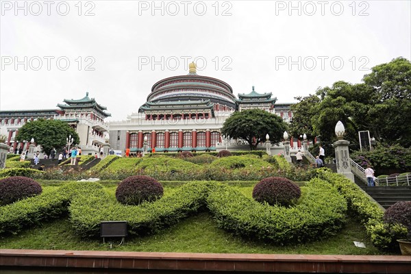 Chongqing City Hall, Chongqing, Chongqing Province, China, A landscape view of a traditional building with green bushes in the foreground, Chongqing, Chongqing, Chongqing Province, China, Asia