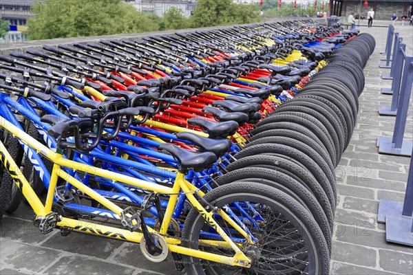 Rental bicycles, Xian, Shaanxi, China, Asia, Ordered rows of bicycles in different colours for public use, Xian, Shaanxi Province, China, Asia