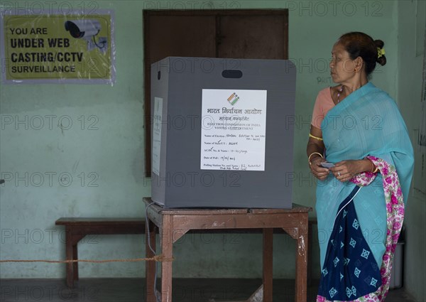 BOKAKHAT, INDIA, APRIL 19: A women casts her vote during the first phase of the India's general elections on April 19, 2024 in Bokakhat, Assam, India. Nearly a billion Indians vote to elect a new government in six-week-long parliamentary polls starting today