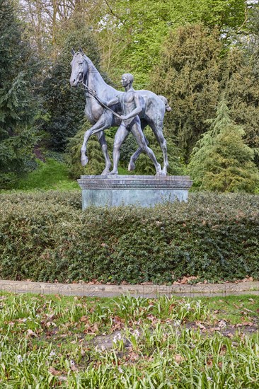 Bronze sculpture The Horse Steer by the sculptor Louis Tuaillon in the Wallanlagen Park in Bremen, Hanseatic City, Federal State of Bremen, Germany, Europe