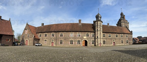 Panoramic photo view from castle courtyard to outer bailey of moated castle Schloss Raesfeld, on the right Sterndeuterturm, Freiheit Raesfeld, Muensterland, North Rhine-Westphalia, Germany, Europe