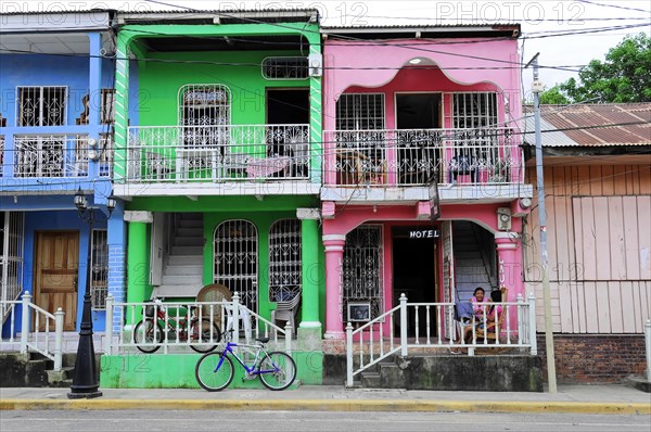 San Juan del Sur, Nicaragua, Colourful houses with a bicycle in the foreground in a tropical urban area, Central America, Central America -, Central America