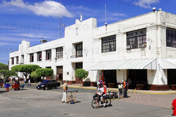 Leon, Nicaragua, Colonial style building in a busy street with people, Central America, Central America