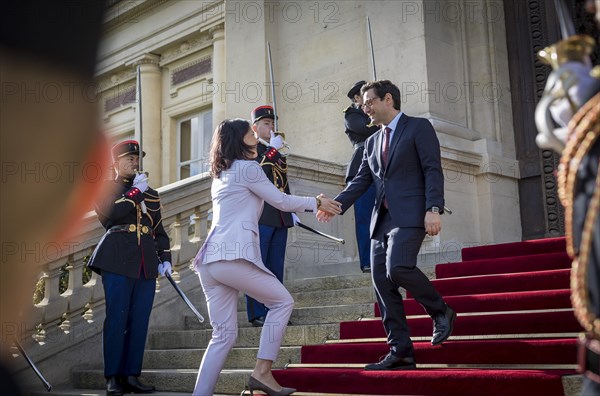 Annalena Baerbock (Alliance 90/The Greens), Federal Foreign Minister, takes a photo as part of her participation in the international humanitarian conference on Sudan and its neighbouring countries. Here she is greeted by Stephane Sejourne, Foreign Minister of France, at the Quai d'Orsay Foreign Ministry. 'Photographed on behalf of the Federal Foreign Office'