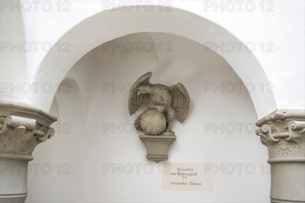 Restored original of the sculpture of the imperial eagle from 1721 from the town hall gable of the town of Wangen, mounted in the Hinderofenhaus, a 16th century official building on the market square of Wangen im Allgaeu, Upper Swabia, Baden-Wuerttemberg, Germany, Europe