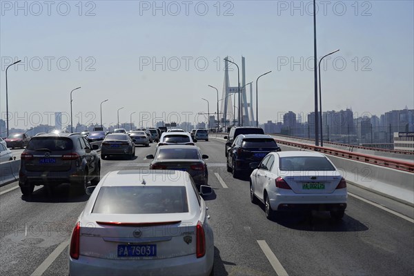 Traffic in Shanghai, Shanghai Shi, People's Republic of China, Heavy traffic with many cars on a suspension bridge in an urban environment, Shanghai, China, Asia