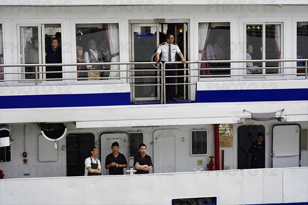 Chongqing, Chongqing Province, China, People standing at the railing of a ship, probably crew members in uniform, Chongqing, Chongqing, Chongqing Province, China, Asia