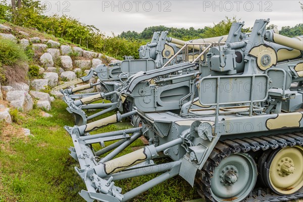 Rear view of military tanks in camouflage paint on display in public park in Nonsan, South Korea, Asia