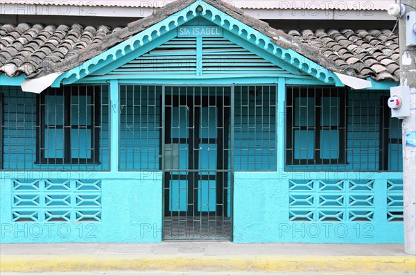 San Juan del Sur, Nicaragua, Turquoise coloured Caribbean house with closed doors and windows, Central America, Central America