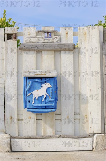 Letterbox with horse motif, Saintes-Maries-de-la-Mer, Camargue, Bouches-du-Rhone, Provence-Alpes-Cote d'Azur, South of France, France, Europe